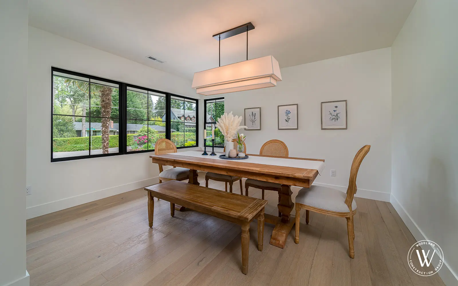 Hemlock dining room after: re-leveled white-oak floor open to the kitchen