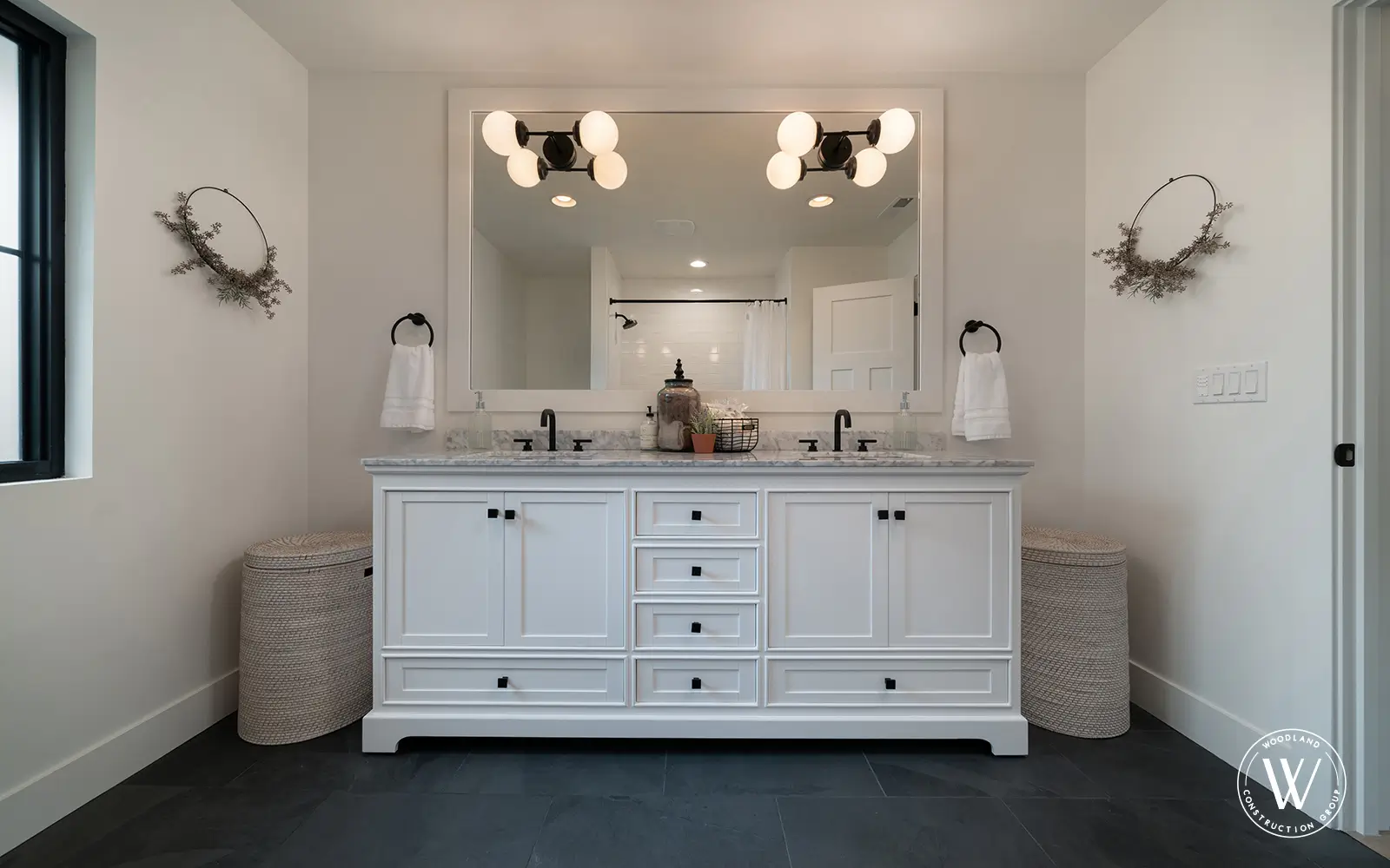Hemlock bath vanity after: white double vanity with marble tops and twin basins