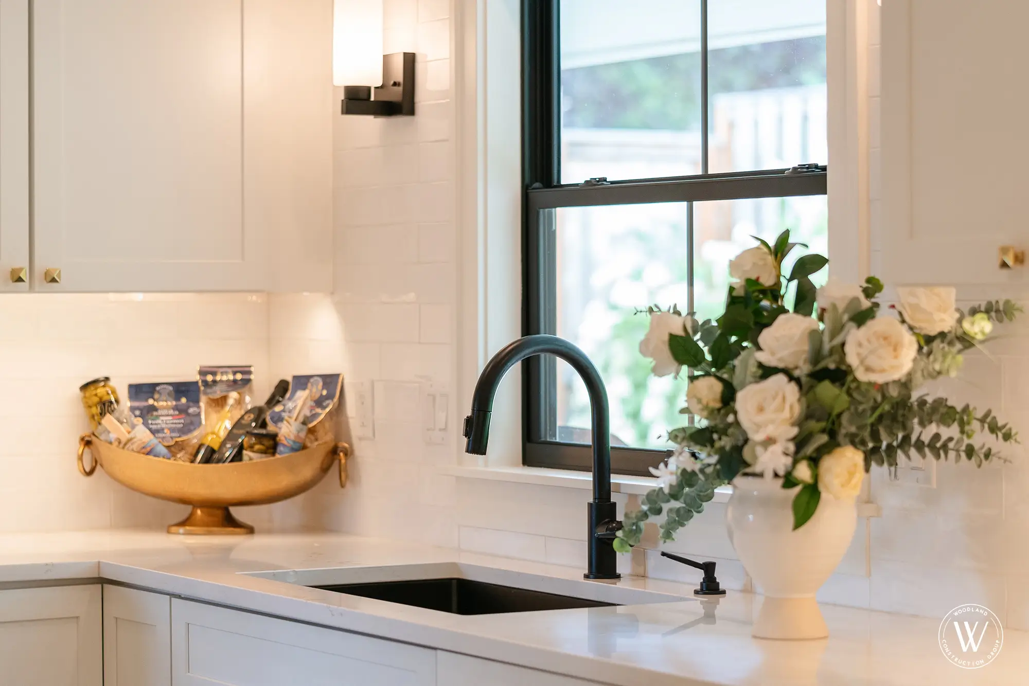 Berkshire kitchen detail with matte-black faucet, undermount sink and a black-framed garden window